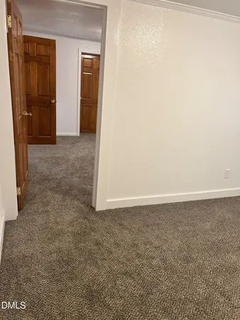 a view of hallway with rug