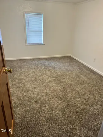 an empty room with a bench