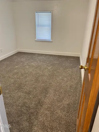 an empty room with a door