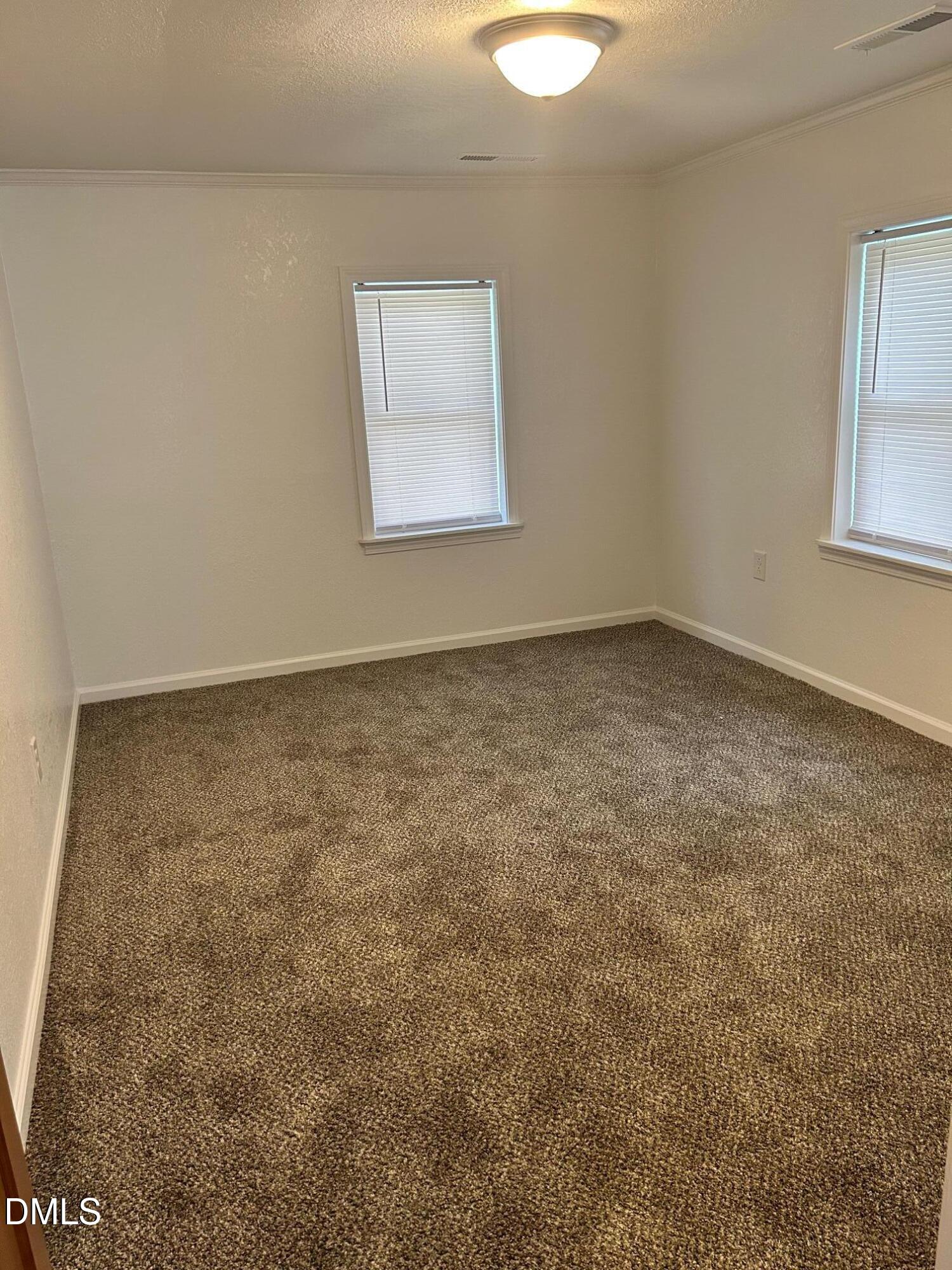 10841 Highway 32 Roper, NC 27970 - Photo 9 of 25 an empty room with a chandeliers fan