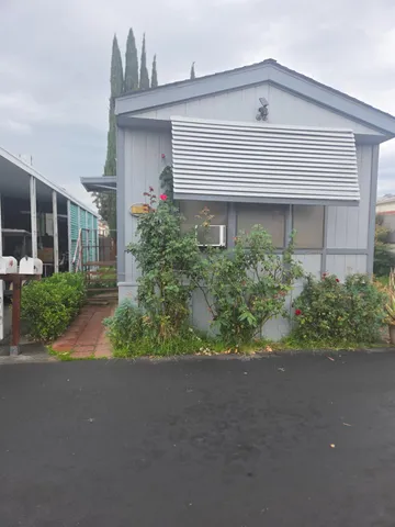 a view of a house with a street