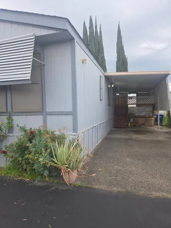 a view of a street with a garage