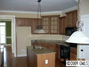 1159 Crossland Road Clover, SC 29710 - Photo 8 of 8 a kitchen with a sink a stove and a wooden floor