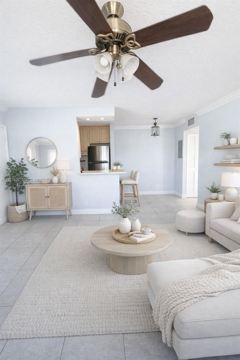 110 Southeast 2nd Street, Unit 312 Hallandale Beach, FL 33009 - Photo 2 of 7 a living room with furniture and a fireplace