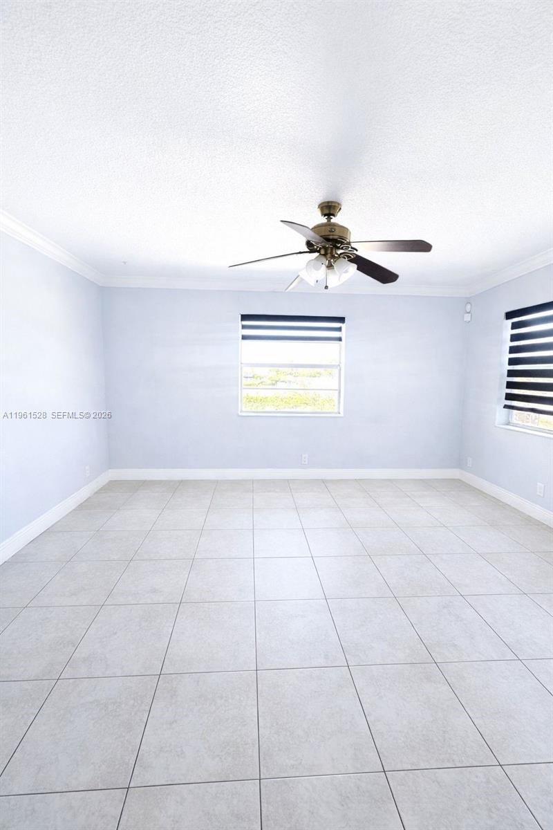 110 Southeast 2nd Street, Unit 312 Hallandale Beach, FL 33009 - Photo 6 of 7 a view of an empty room and window