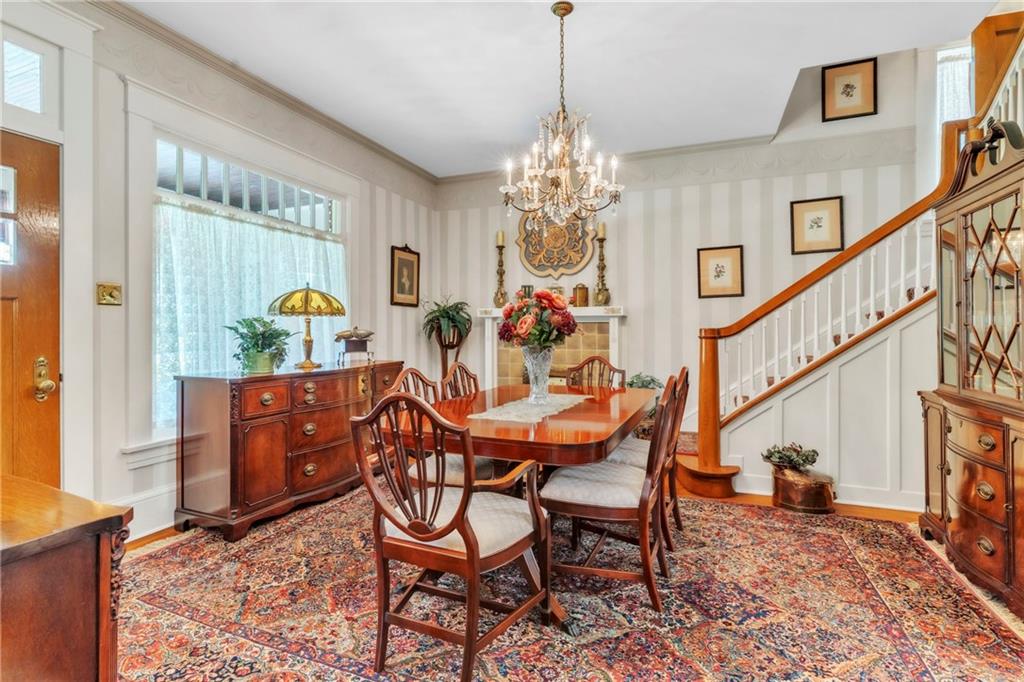 223 Belmont Road Butler, PA 16001 - Photo 12 of 50 a view of a dining room with furniture a chandelier and wooden floor
