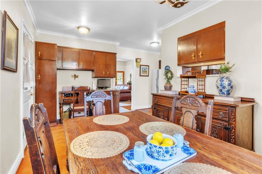 223 Belmont Road Butler, PA 16001 - Photo 20 of 50 a living room with stainless steel appliances granite countertop a dining table and chairs with wooden floor