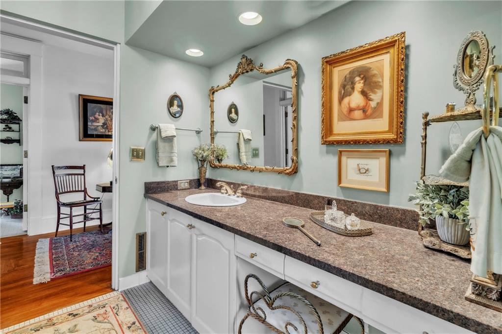 223 Belmont Road Butler, PA 16001 - Photo 30 of 50 a bathroom with a granite countertop sink and a mirror