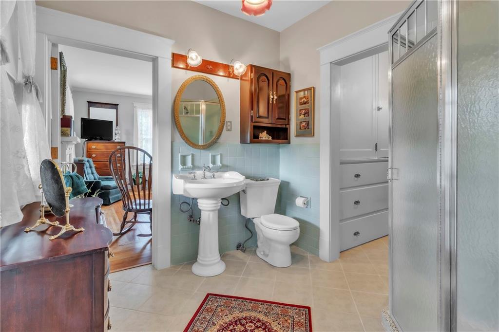 223 Belmont Road Butler, PA 16001 - Photo 34 of 50 a bathroom with a sink a toilet and a mirror