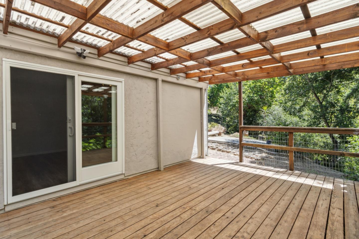 24895 Skyland Road Los Gatos, CA 95033 - Photo 45 of 113 a view of a room with wooden floor and iron stairs
