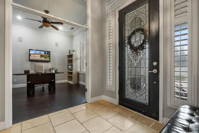 a view of a dining room with furniture and a chandelier