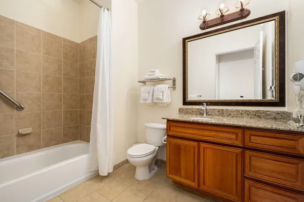 a bathroom with a toilet a sink and bathtub
