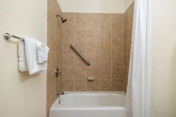 a bathroom with a bath tub