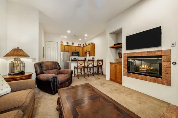 a living room with furniture and a fireplace