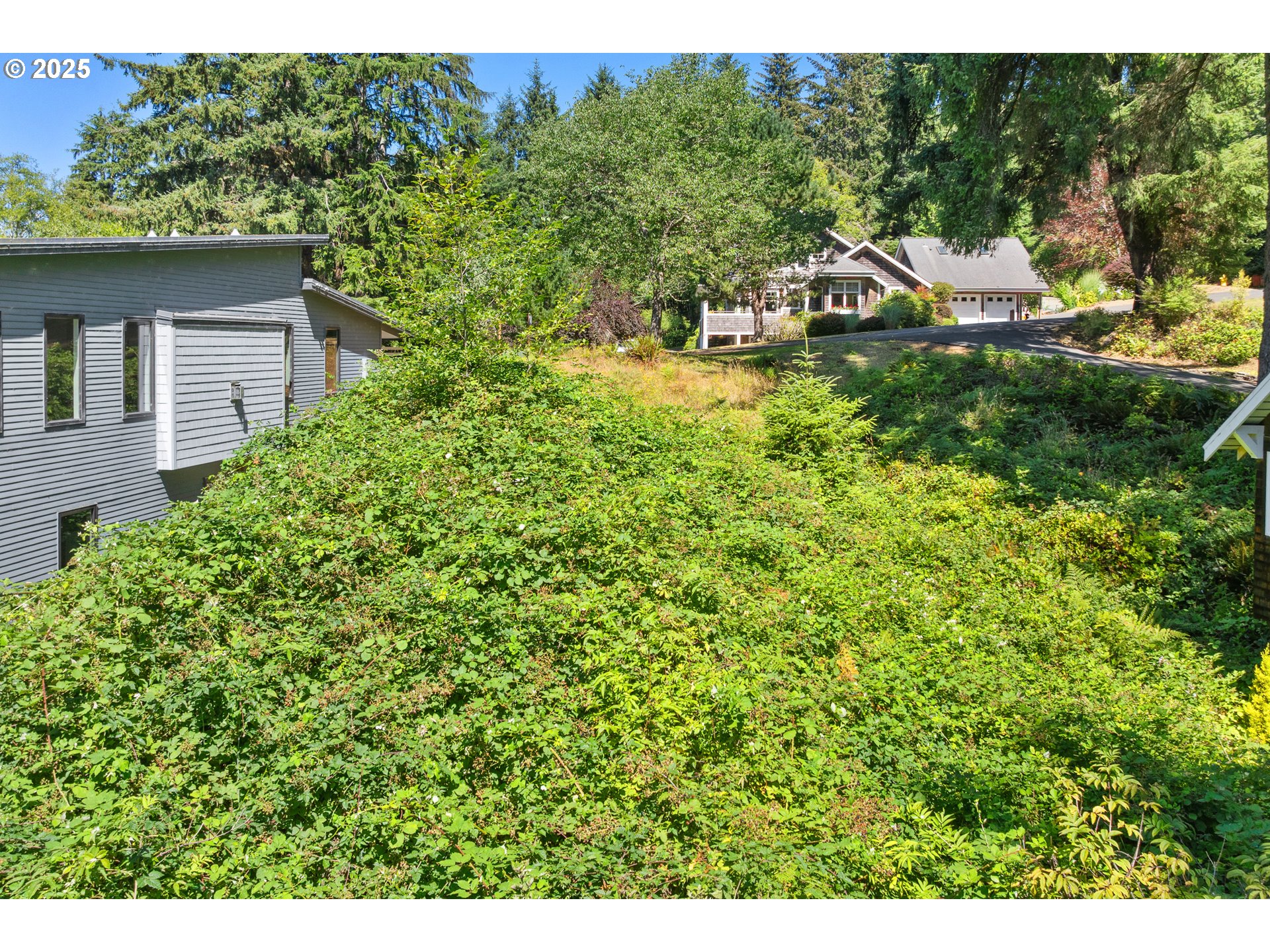 0 East 6th Street Cannon Beach, OR 97110 - Photo 15 of 15 a view of a house with a yard and sitting area