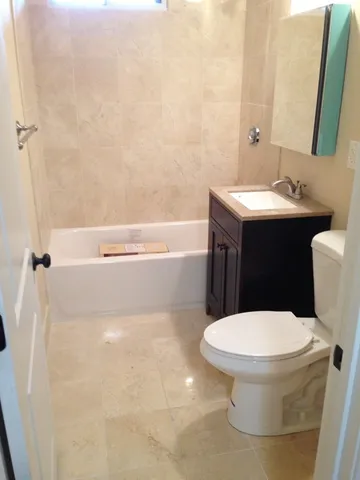 a bathroom with a toilet and a sink