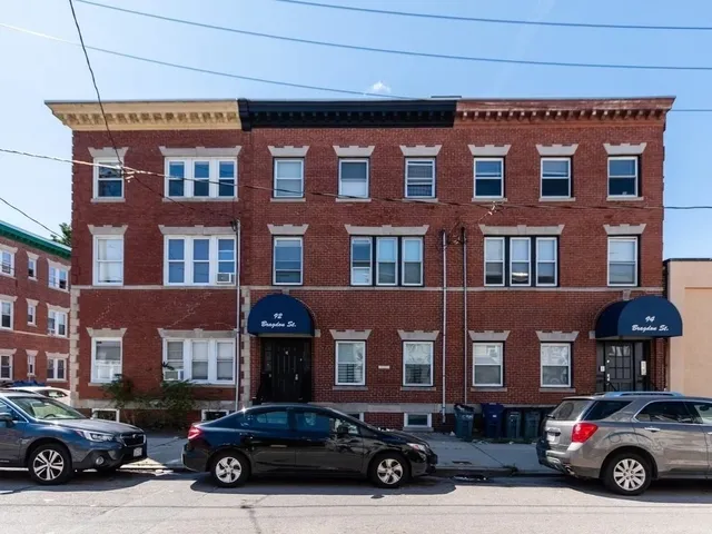 a car parked in front of a building