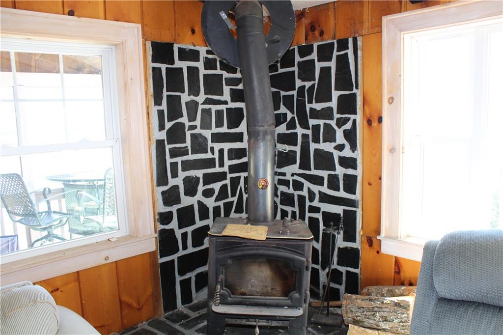 257 Ironbound Pond Road Solon, ME 04979 - Photo 18 of 30 Wood stove and hearth.