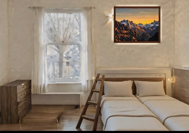 a bedroom with a bed and a painting on the wall