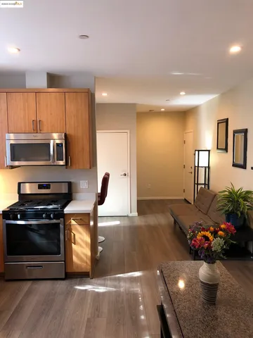 a kitchen with a sink and a stove top oven