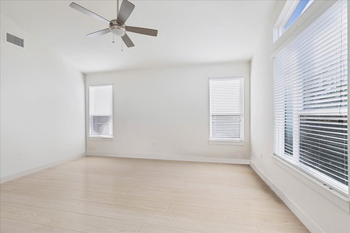 8922 Manchaca Road, Unit 906 Austin, TX 78748 - Photo 18 of 30 an empty room with a window and a fan