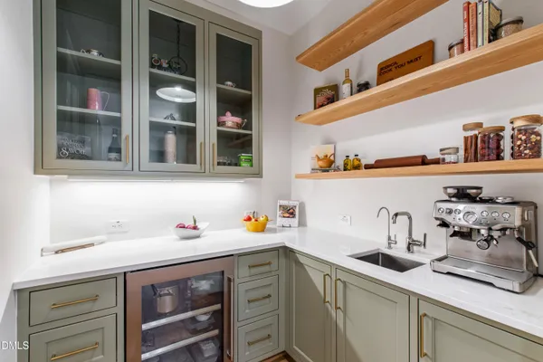 a kitchen with a table and chairs in it