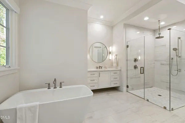 a bedroom with a large bed and a large window