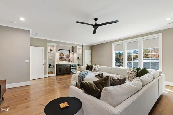 a spacious bedroom with a bed and a couch