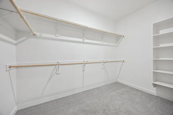 a view of an empty walk in closet