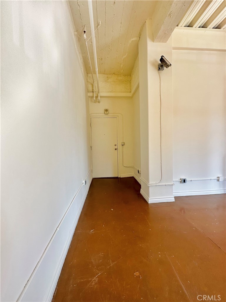 312 West 5th Street, Unit M1 Los Angeles, CA 90013 - Photo 2 of 8 an empty room with a door