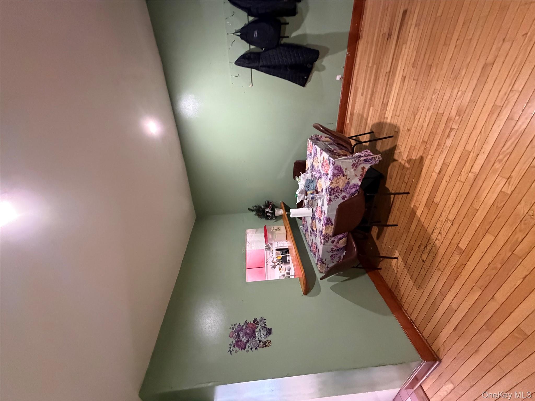 35-13 103rd Street Queens, NY 11368 - Photo 6 of 13 a room with furniture and a wooden floor