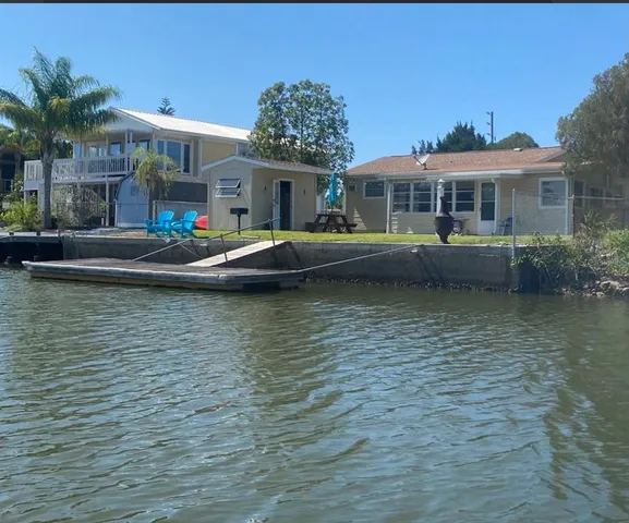 a front view of a house with a large pool