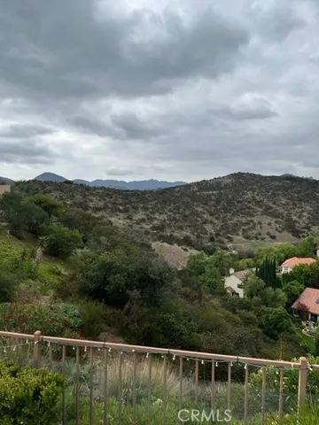 a view of a city with lush green forest