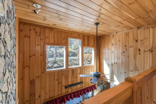 a bedroom with a bed dresser and a window