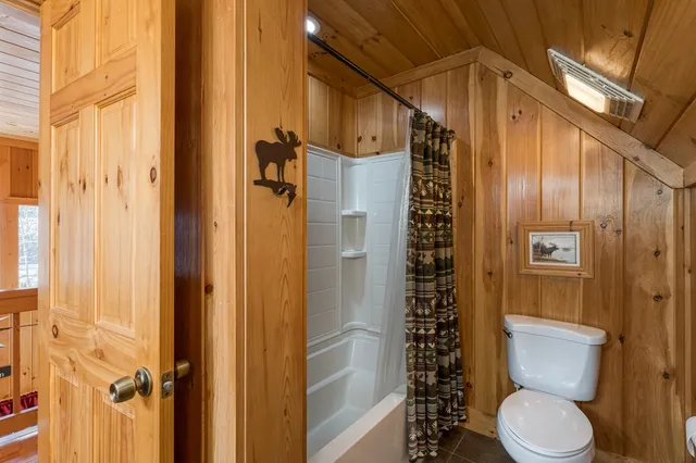 a room with wooden floors and white walls