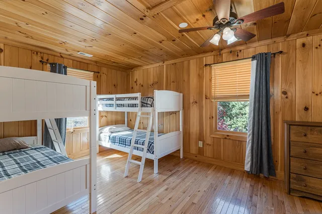 a view of a livingroom with furniture and a ceiling fan