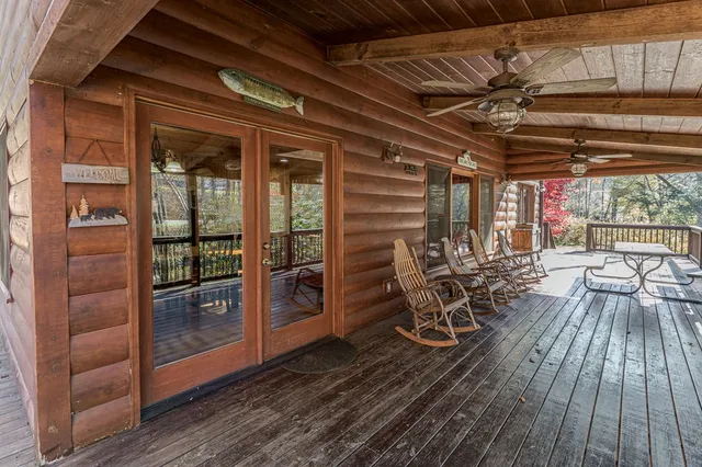 a view of lot of trees with yard