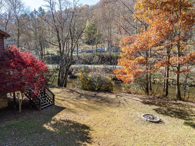 a view of a brick house with a yard