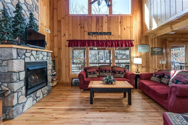 a outdoor living space with patio furniture and a fireplace
