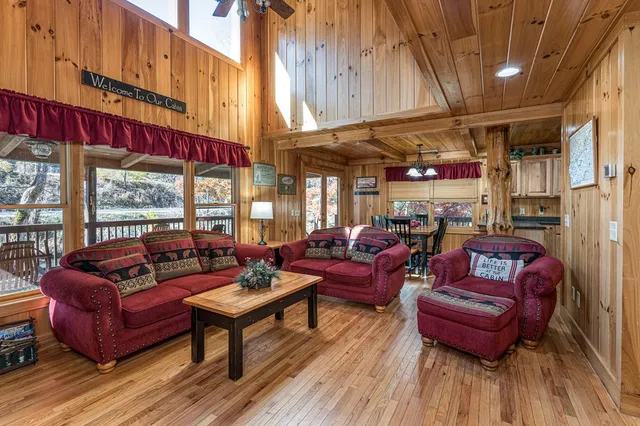 a kitchen with stainless steel appliances granite countertop a refrigerator a sink and wooden cabinets