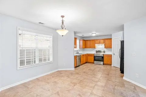 a view of a kitchen with a sink and a window