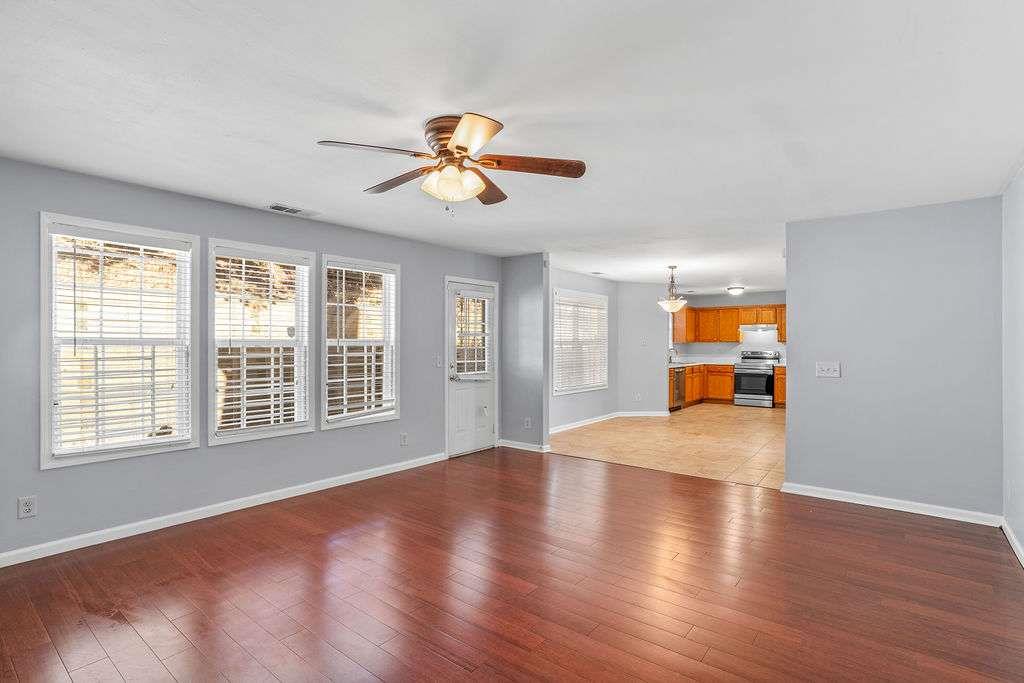 1461 Enchanted Forest Drive Conley, GA 30288 - Photo 19 of 47 a view of an empty room with a window and wooden floor
