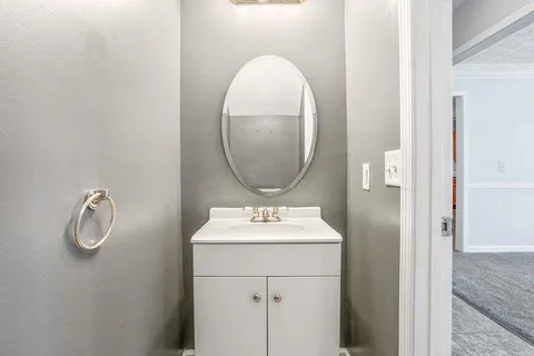 a bathroom with a sink and mirror