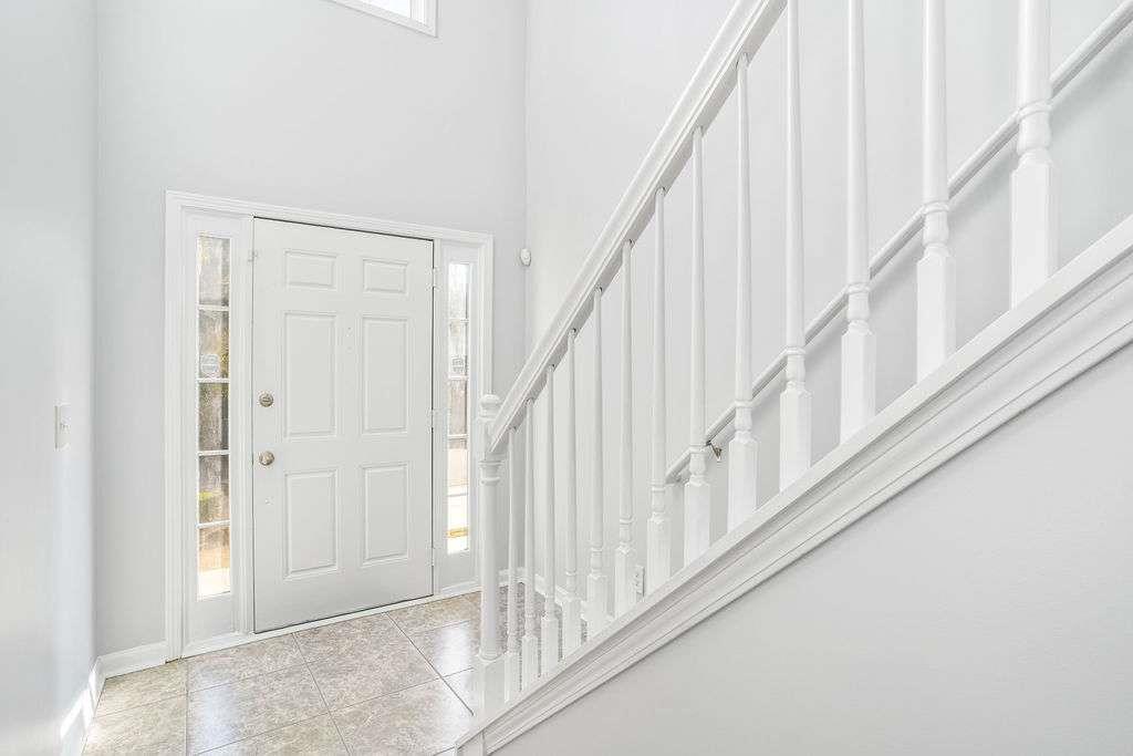 1461 Enchanted Forest Drive Conley, GA 30288 - Photo 22 of 47 a view of staircase with white walls and white walls
