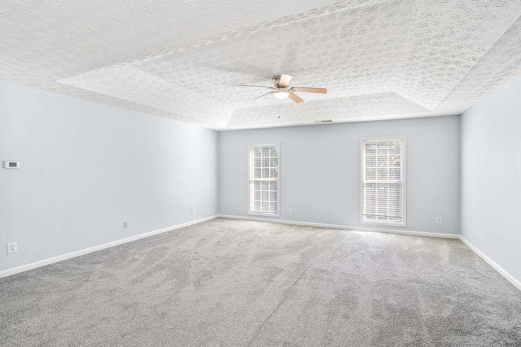 1461 Enchanted Forest Drive Conley, GA 30288 - Photo 25 of 47 a view of an empty room with a window