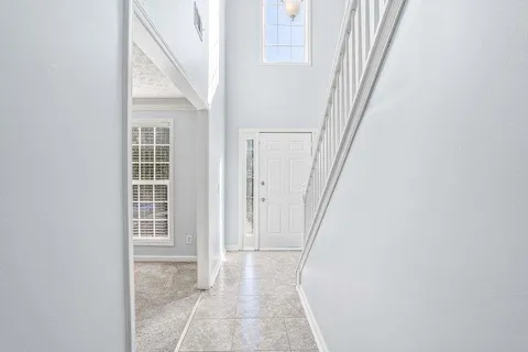 a view of a hallway with windows