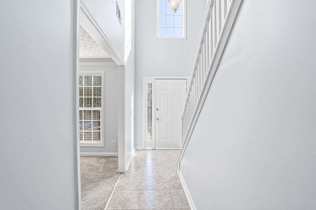 1461 Enchanted Forest Drive Conley, GA 30288 - Photo 4 of 47 a view of a hallway with windows