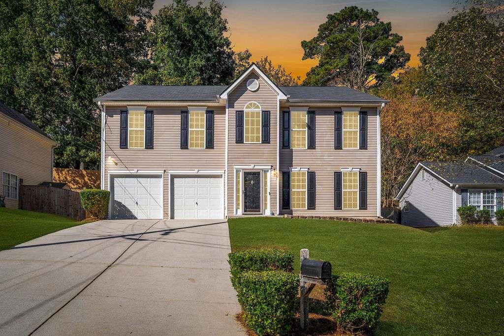 1461 Enchanted Forest Drive Conley, GA 30288 - Photo 46 of 47 a front view of a house with a yard