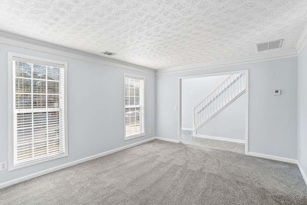 1461 Enchanted Forest Drive Conley, GA 30288 - Photo 6 of 47 an empty room with windows