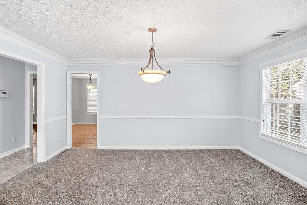 1461 Enchanted Forest Drive Conley, GA 30288 - Photo 9 of 47 a view of an empty room with a window